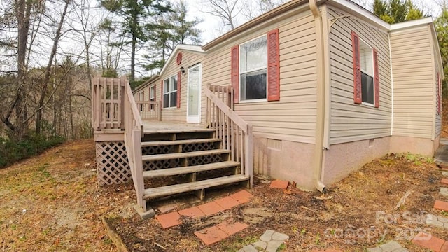 view of property exterior featuring a deck