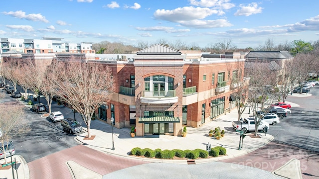 view of property featuring uncovered parking