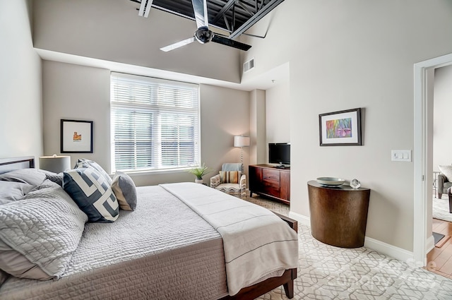 bedroom with visible vents, ceiling fan, and baseboards