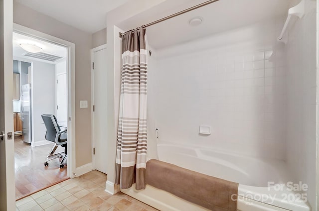 bathroom with baseboards, shower / bath combination with curtain, visible vents, and tile patterned floors