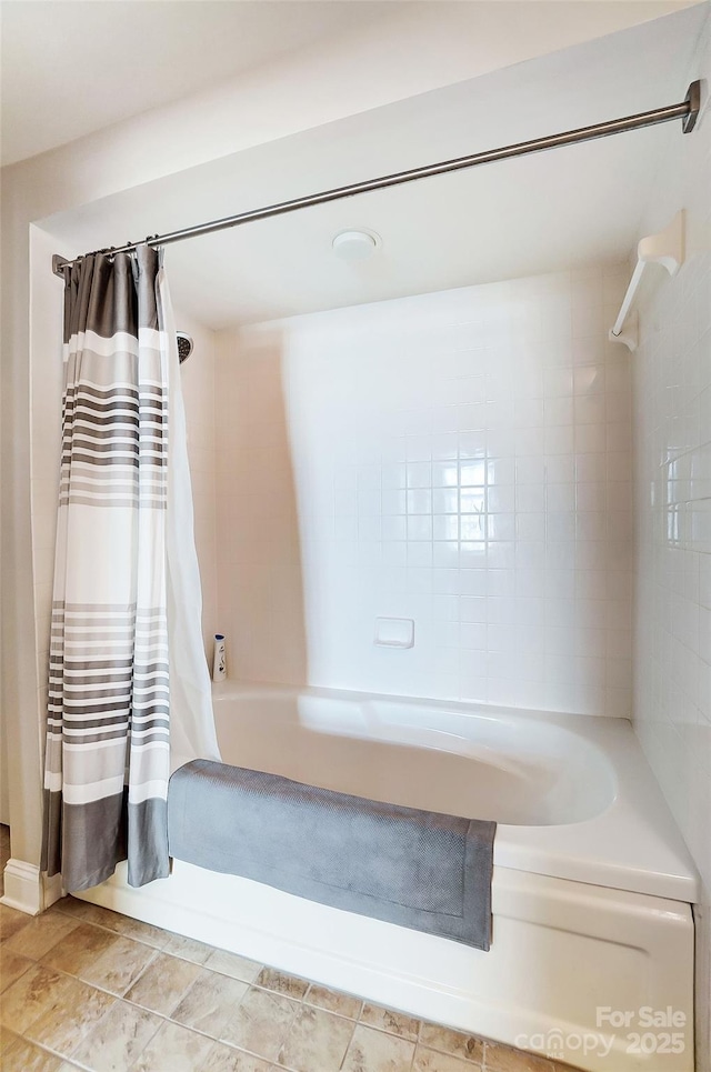 full bath featuring shower / tub combo with curtain