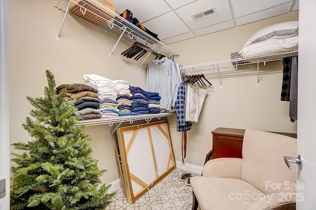 spacious closet featuring a paneled ceiling and visible vents