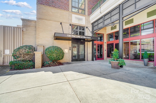 entrance to property with brick siding