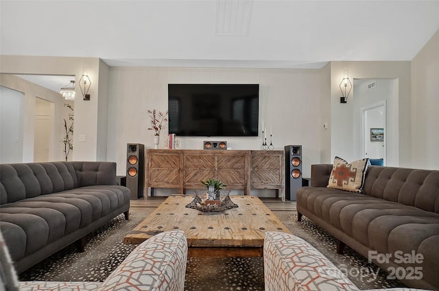 living room with visible vents and wood finished floors