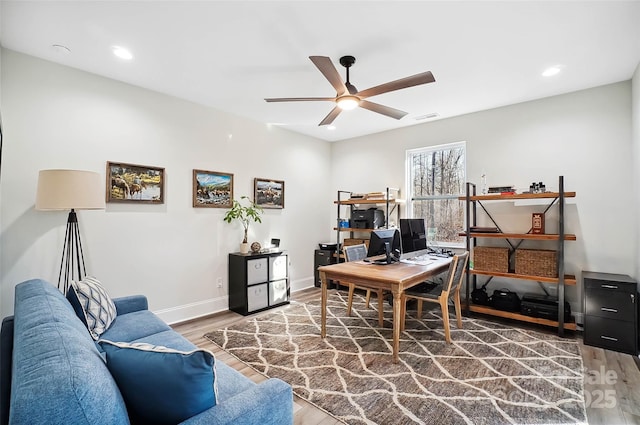 office featuring baseboards, visible vents, a ceiling fan, wood finished floors, and recessed lighting