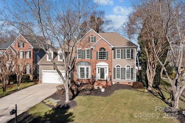 view of front of property featuring a front yard and a garage