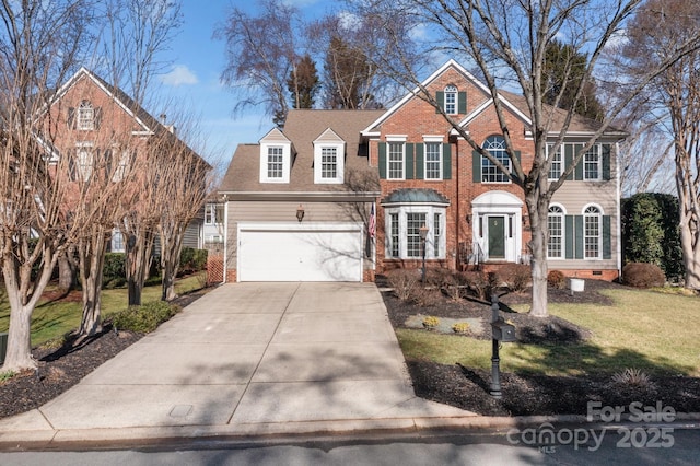 view of front of home with a front yard and a garage