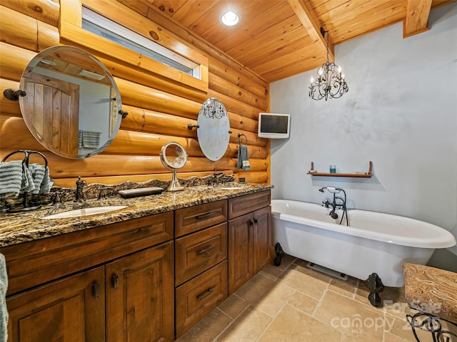 full bath with a freestanding tub, wood ceiling, a sink, and stone tile floors