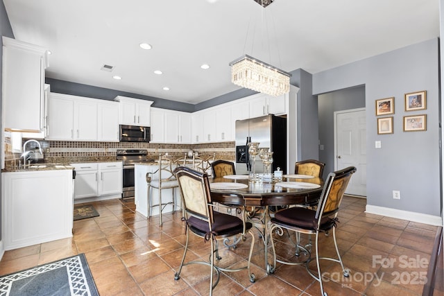 dining space featuring sink