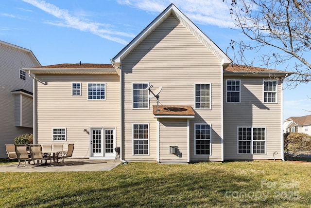 back of house with a patio area and a yard