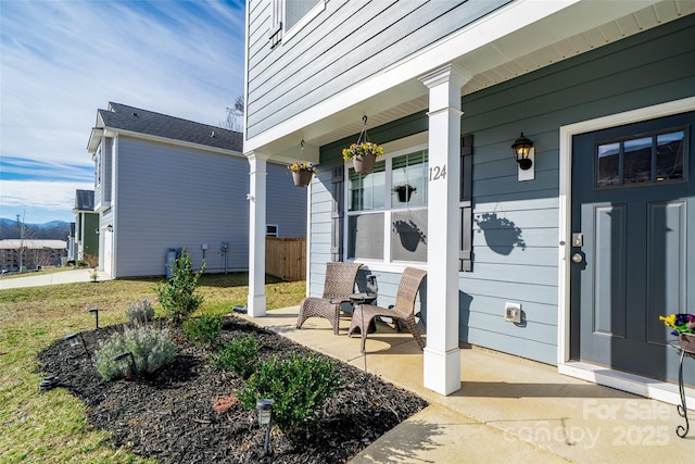 property entrance featuring covered porch