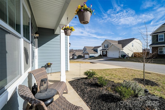 view of patio featuring a residential view and covered porch