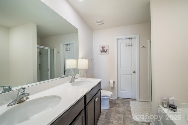 full bathroom with a stall shower, visible vents, a sink, and toilet