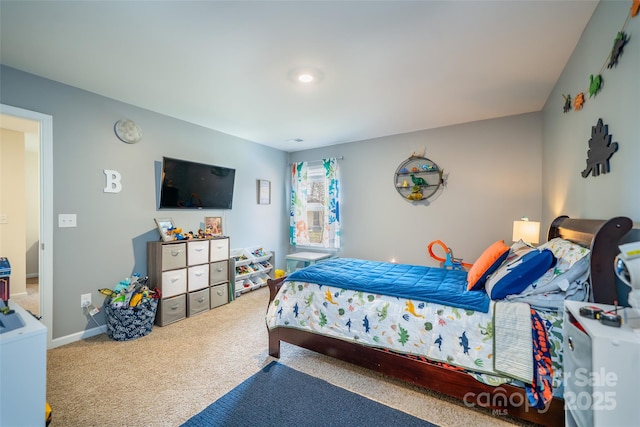 carpeted bedroom with baseboards