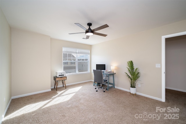 office featuring carpet floors, ceiling fan, and baseboards