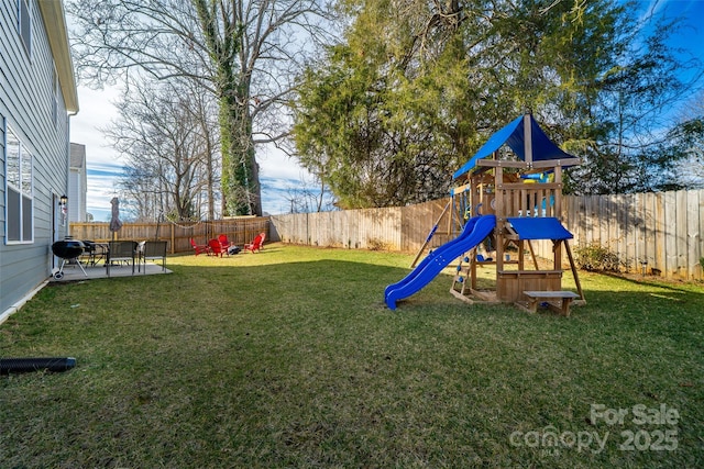 view of play area featuring a yard and a fenced backyard