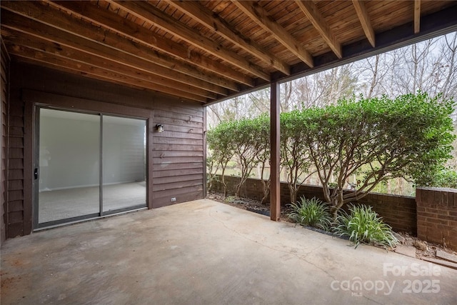 view of patio featuring fence