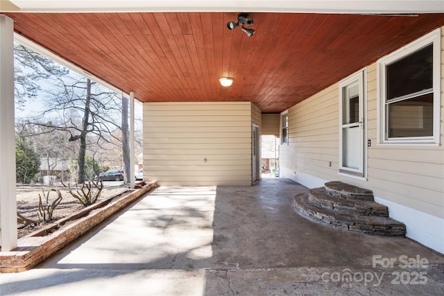 view of patio / terrace with a carport