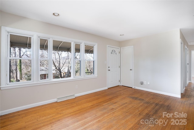 interior space featuring visible vents, recessed lighting, light wood-style flooring, and baseboards