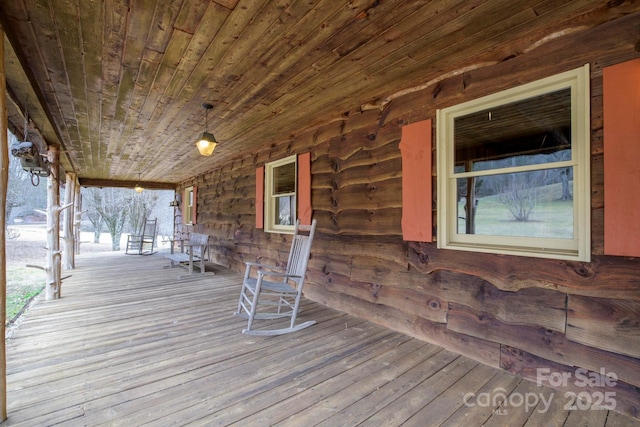 wooden terrace with a porch