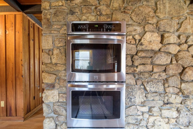 interior details featuring stainless steel double oven