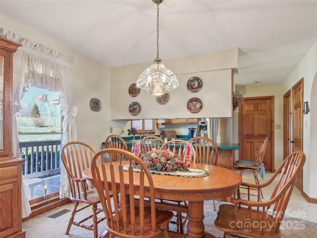 dining area featuring a chandelier