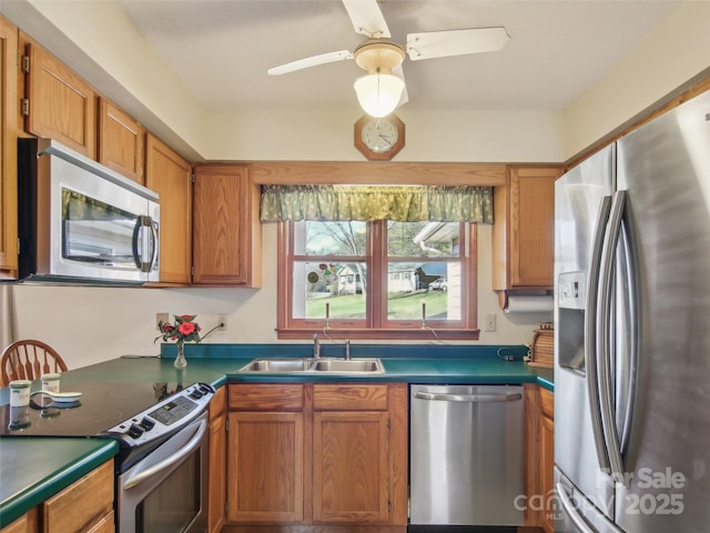 kitchen featuring sink, appliances with stainless steel finishes, and ceiling fan