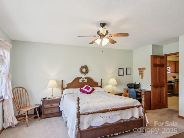 bedroom featuring light carpet and ceiling fan