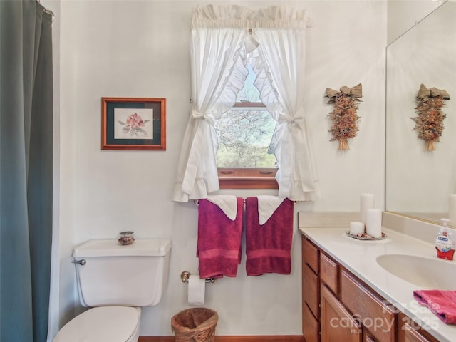 bathroom with vanity and toilet