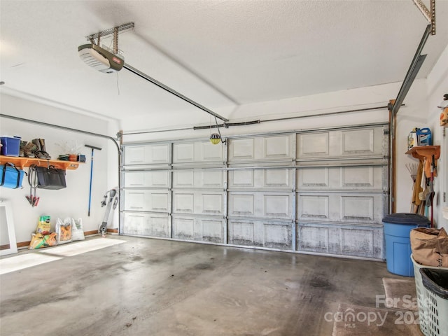 garage featuring a garage door opener