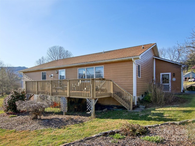 back of house with a wooden deck