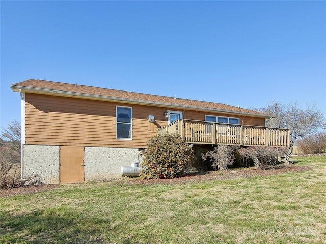 back of house featuring a yard and a deck