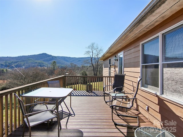 wooden terrace featuring a mountain view