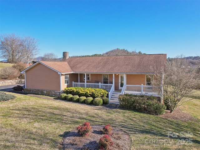 single story home featuring a front lawn and a porch