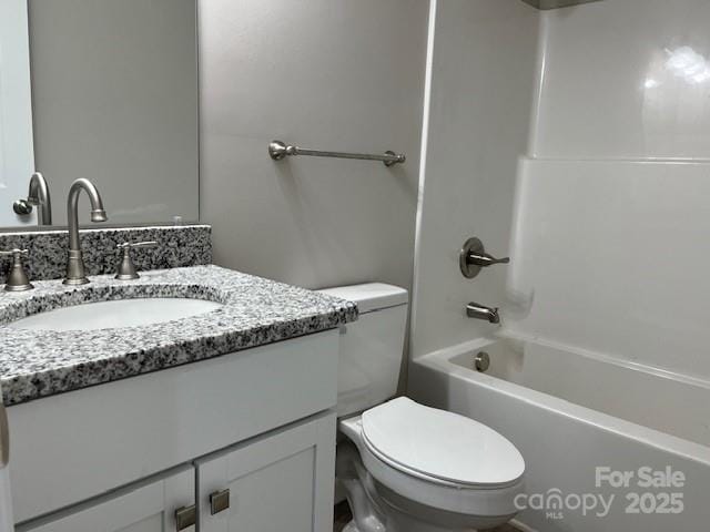 full bathroom with toilet, vanity, and shower / bathing tub combination