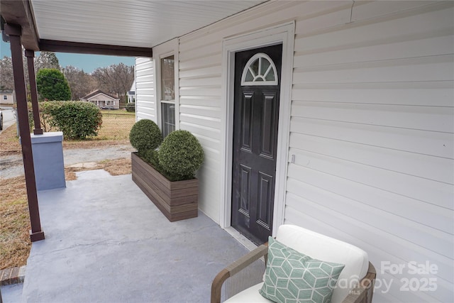 property entrance featuring covered porch