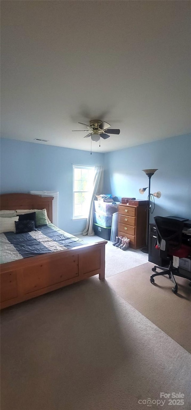 carpeted bedroom with ceiling fan