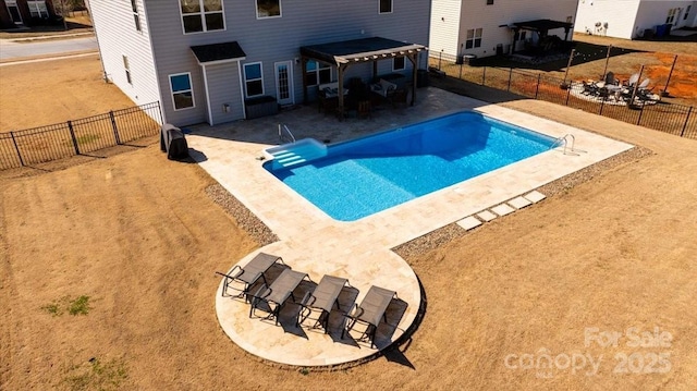 view of pool featuring a patio, a fenced backyard, and a fenced in pool