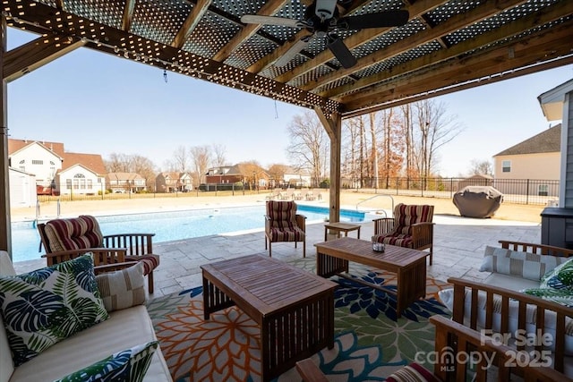 view of patio featuring an outdoor hangout area, fence, a community pool, and a pergola