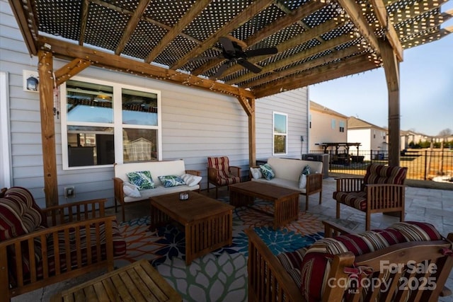 wooden terrace featuring a patio, outdoor lounge area, fence, and a pergola