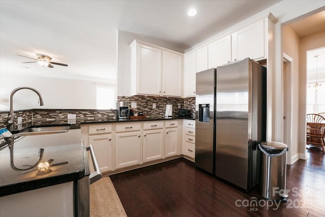 kitchen with tasteful backsplash, dark wood-style flooring, a sink, and stainless steel refrigerator with ice dispenser