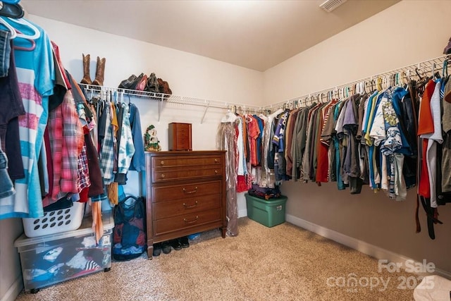 walk in closet with carpet floors and visible vents