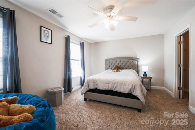 carpeted bedroom featuring baseboards, visible vents, and a ceiling fan