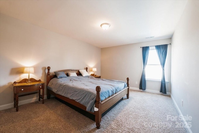 bedroom with light carpet, visible vents, and baseboards