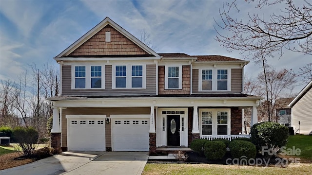 craftsman inspired home with covered porch, central AC, and a garage