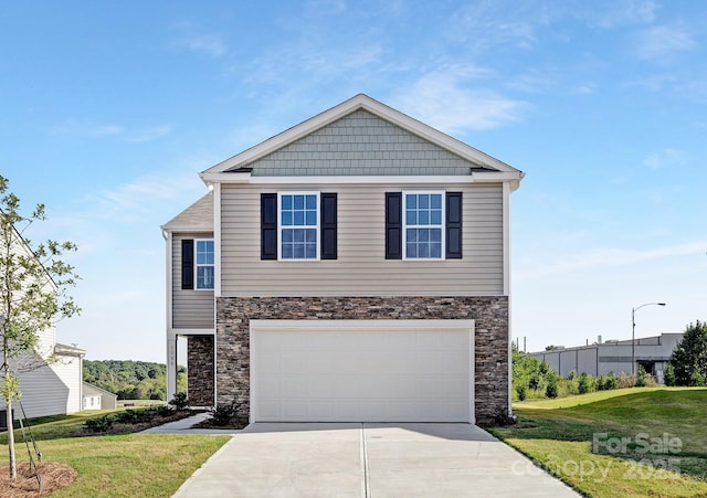 view of front of home featuring a front yard and a garage