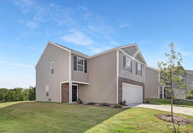 view of front of house featuring a front lawn and a garage