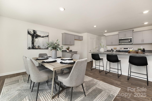 dining room featuring dark hardwood / wood-style flooring