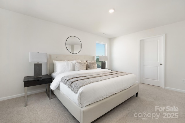 bedroom featuring light colored carpet