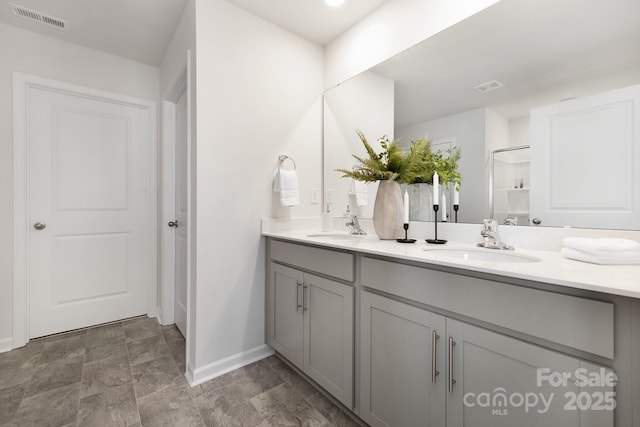 bathroom with vanity and walk in shower